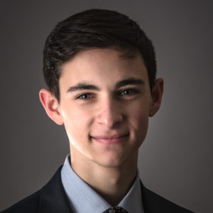 photo of a striking young man in a dress suit