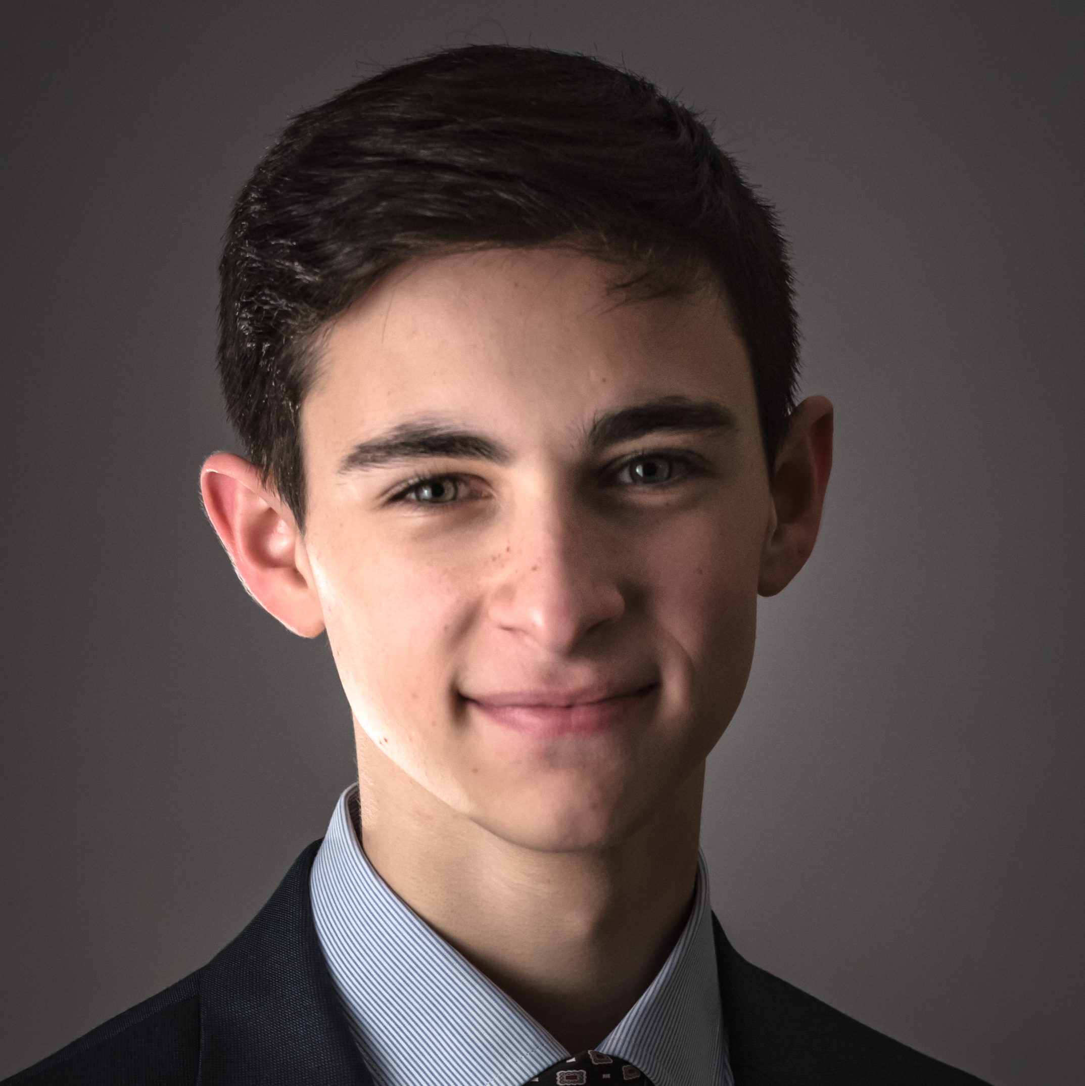 photo of a striking young man in a dress suit